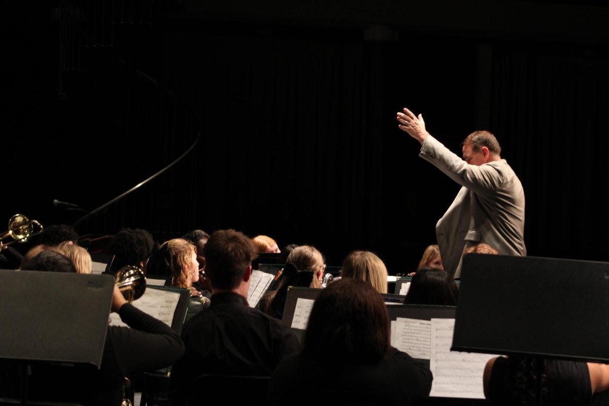 Mr. Cassidy conducting the 11th and 12th grade band for the final performance of the night.