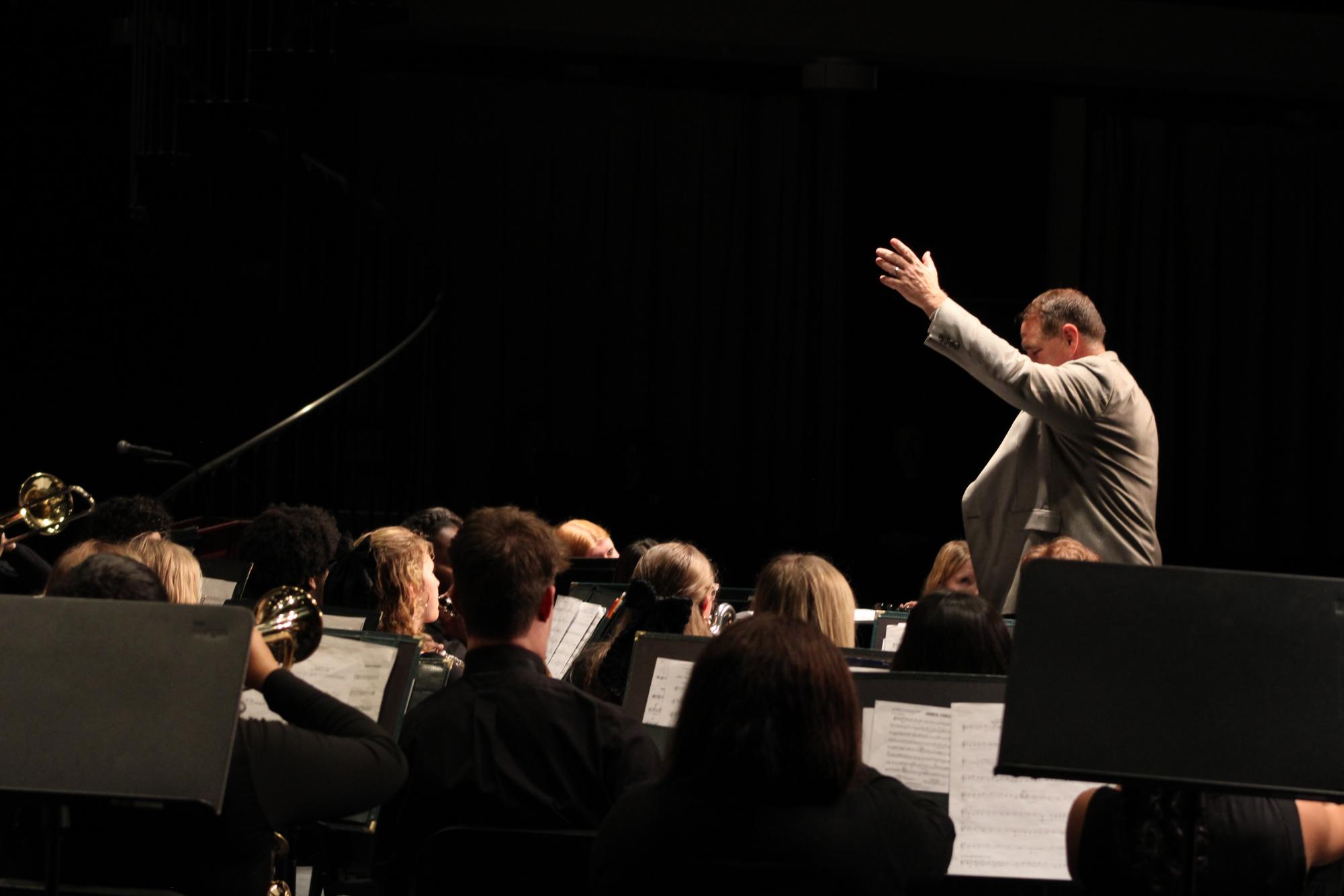 Mr. Cassidy conducting the 11th and 12th grade band for the final performance of the night.