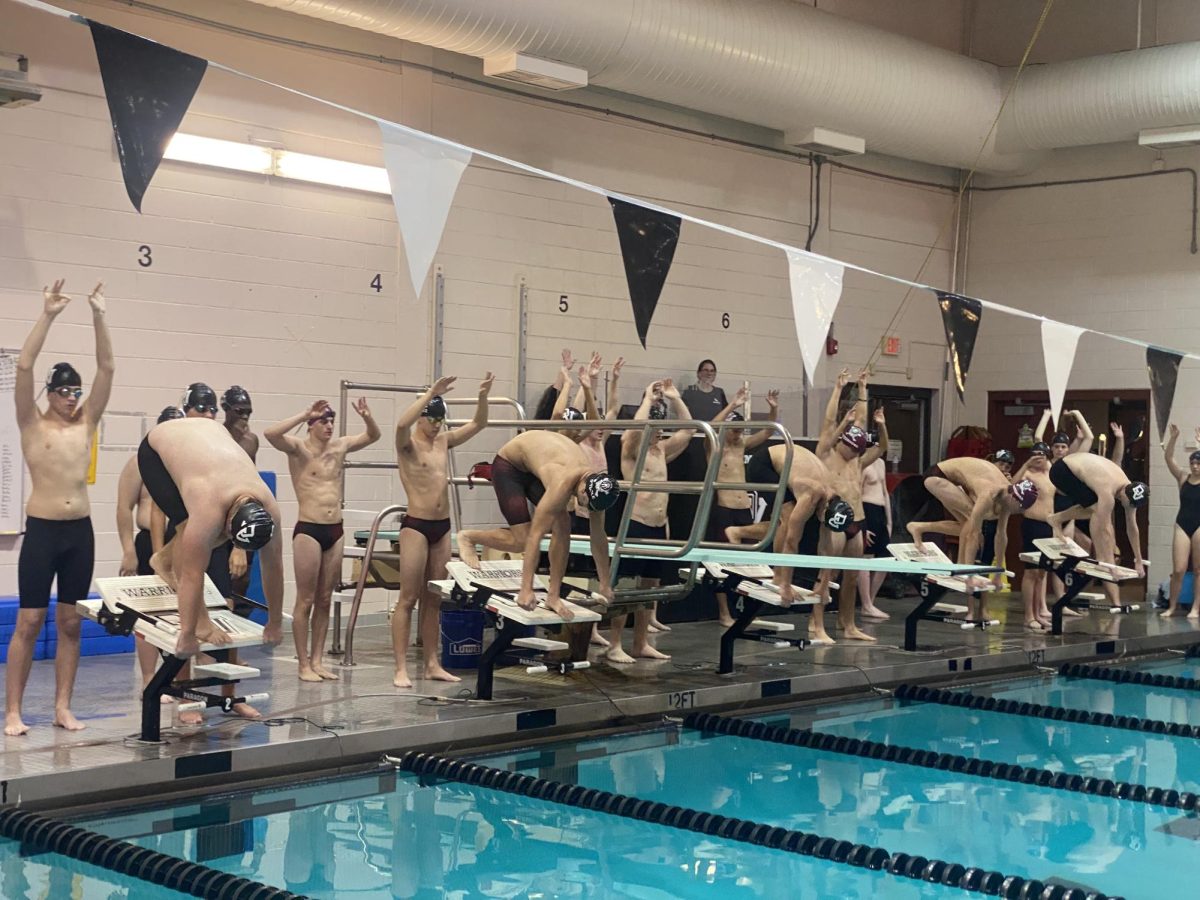 Stroudsburg boys' team competing in the 200 yard freestyle relay at Delaware Valley High School.