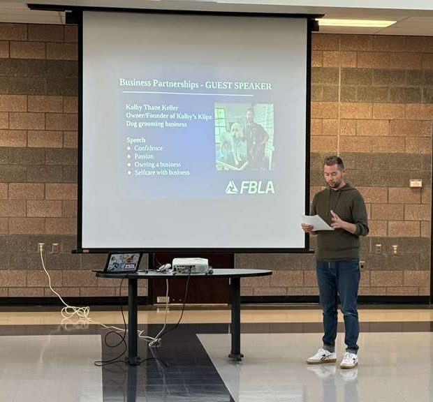 Kolby Keller, an entrepreneur who started a dog grooming business, talking to FBLA members about his journey.