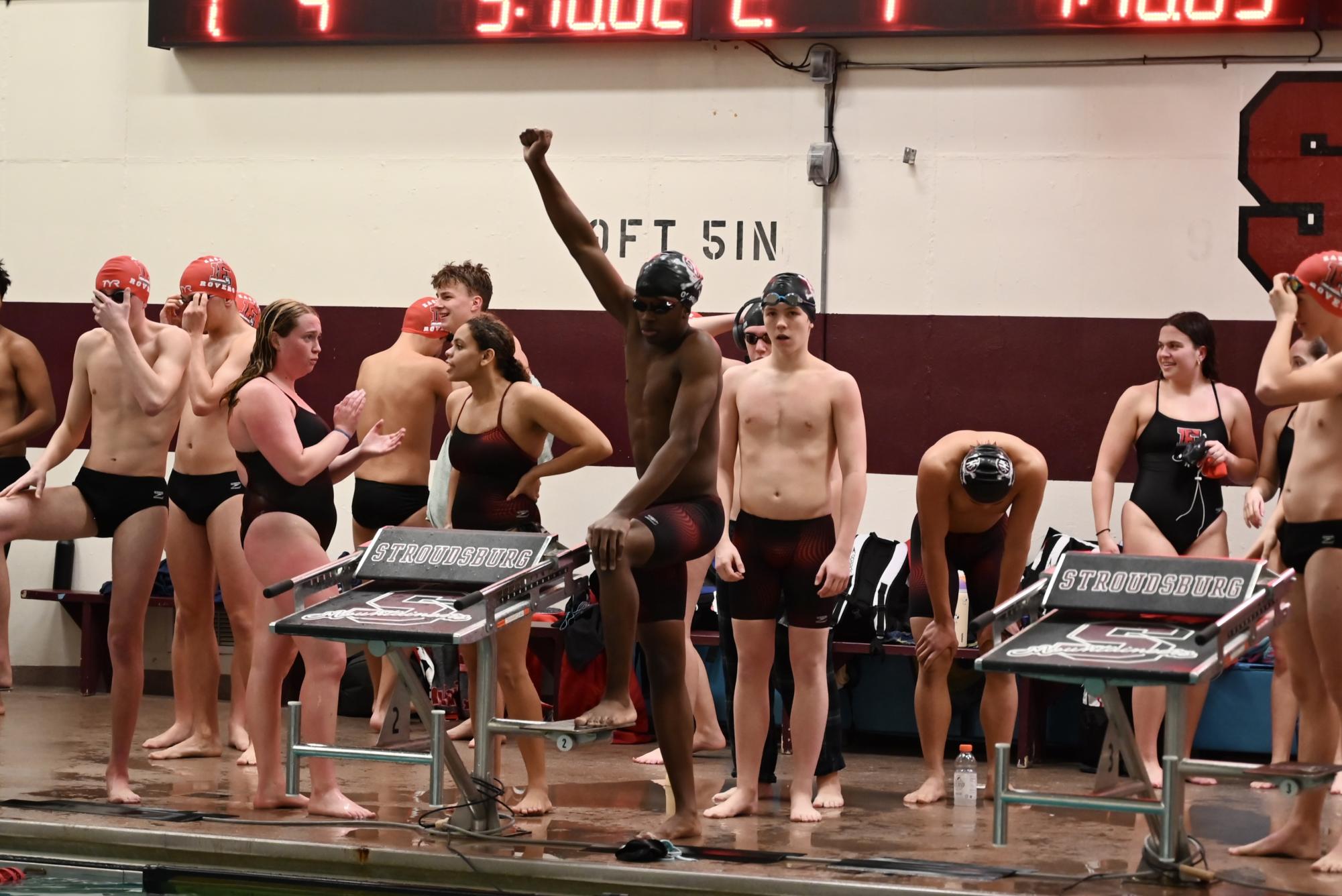 Chudi Ogbolu, '27, getting ready as the first leg in a 400 freestyle relay that would decide the meet on the boys' side.