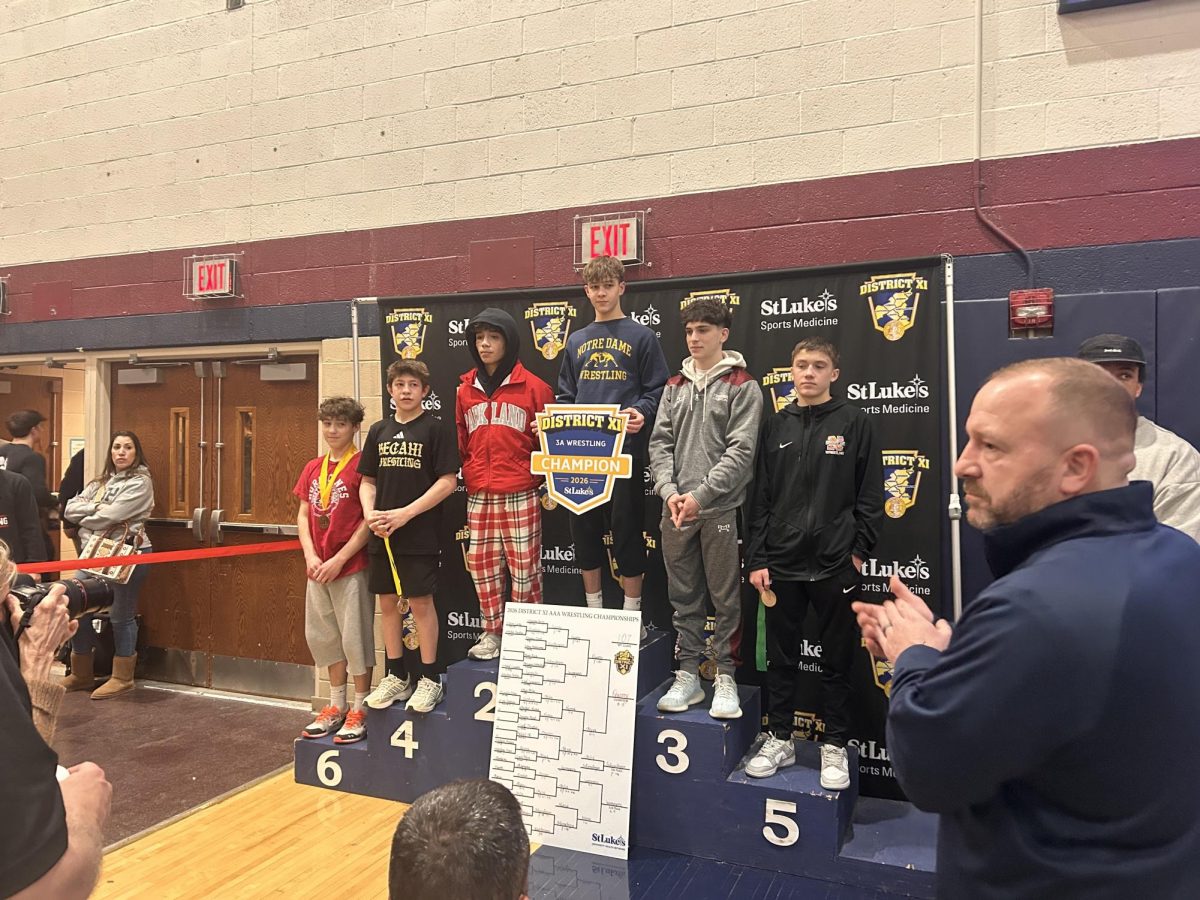 Jack Jasionowicz stands on the podium at the District tournament!