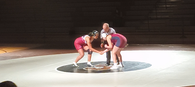 Jasmine Chapman, '26 shaking hands with an opponent before the match begins.