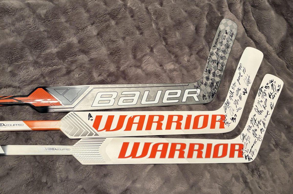 An image featuring three signed goalie sticks from the Lehigh Valley Phantoms