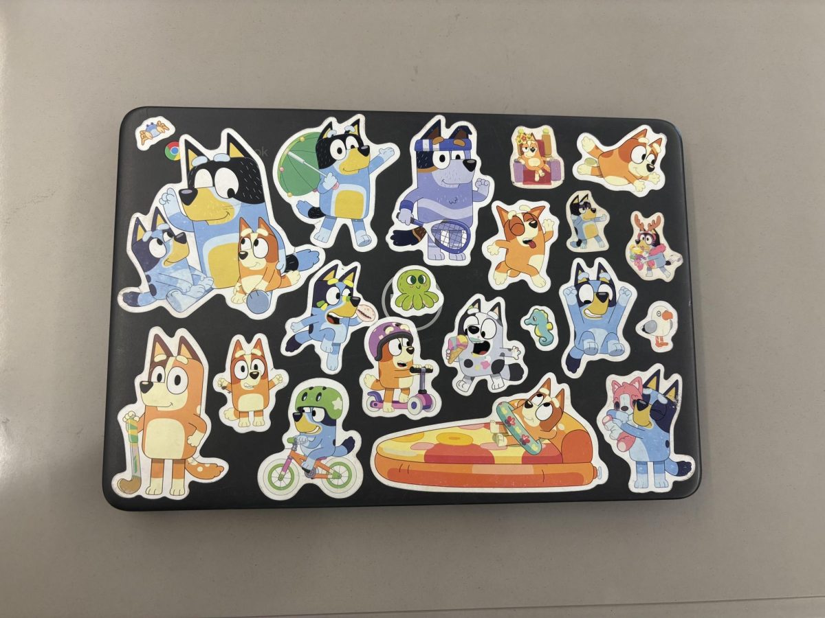 Jordan Cook '27's chromebook decked out in Bluey stickers.