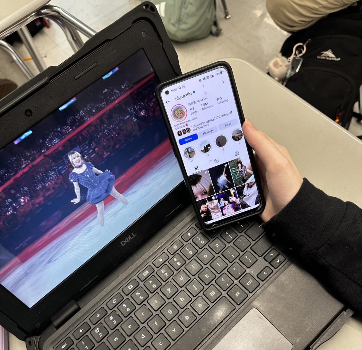 A student looking at Alysa Liu´s Instagram while watching her Exhibition Gala performance. 
