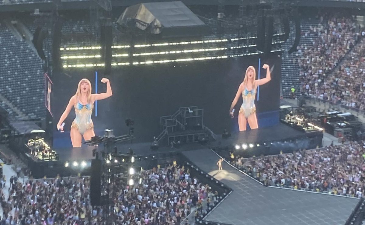 Taylor Swift flexing her muscles at "The Eras Tour." in East Rutherford, New Jersey.