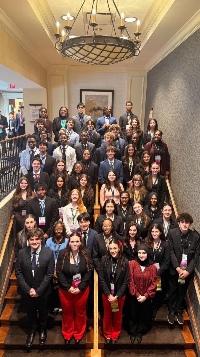 SLC attendees lines up at the staircase at Hershey Lodge for a group photo.