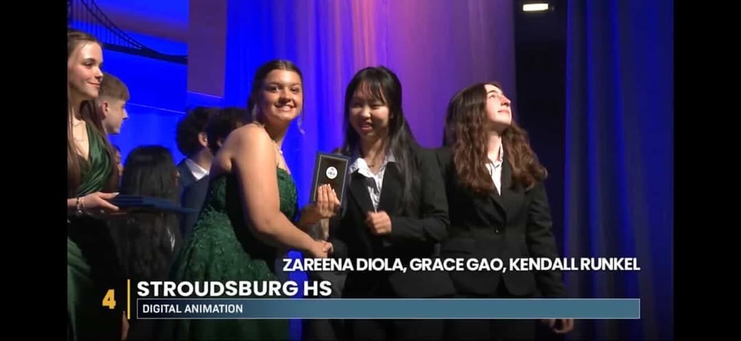 Zareena Diola '27, Grace Gao '27, and Kendall Runkel '27 receaving their plaque for 4th place in Digital Animation. 