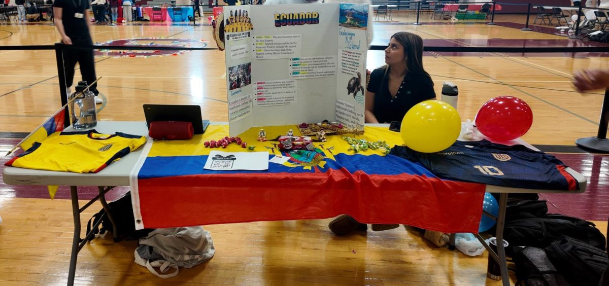 Delaney Jimenez, '27 at booth 1 for Ecuador.